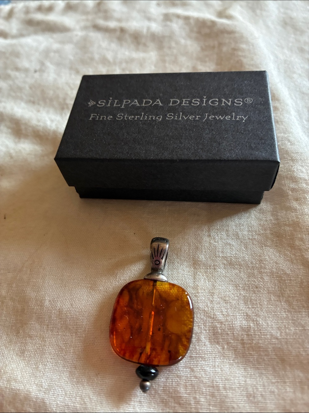 Silpada Amber Pendant with Sterling Bail and onyx accent.N1285 retired.